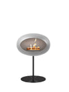Le Feu Nickel Steel Low Dome met een zwarte basis en een sfeervol vlammenspel