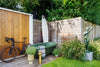 Lime Groen Gardentub naast Surfplank